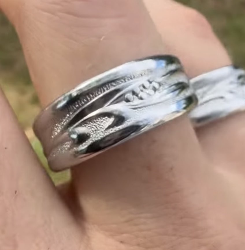 Engraved ring on finger