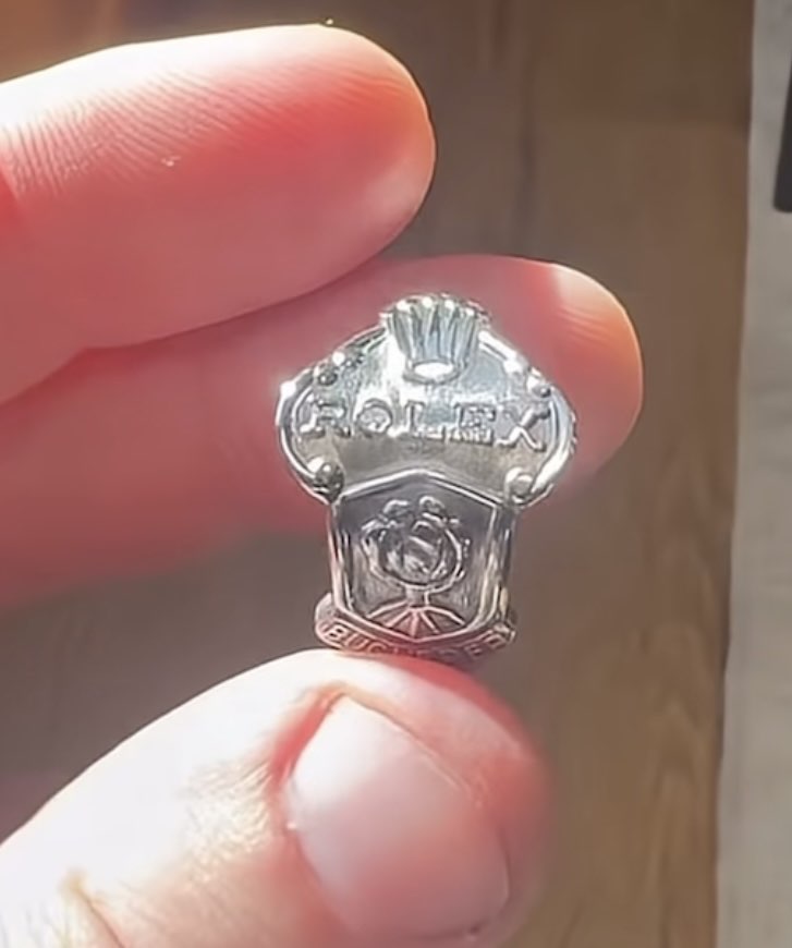 Decorative ring held in fingers